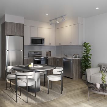 A modern kitchen with a round table and chairs at Roxy Apartments, Hamilton, ON, L8H 0B7